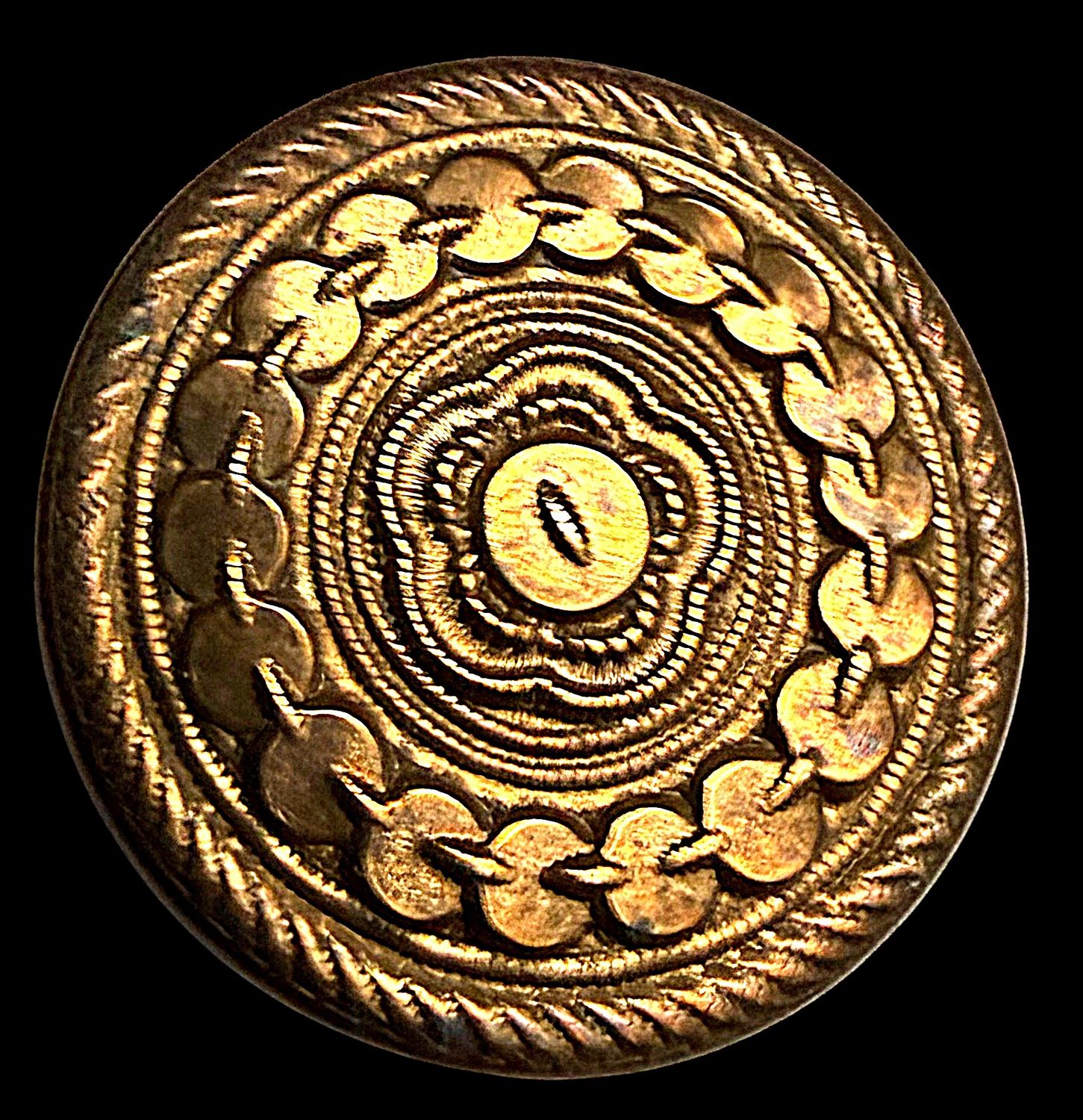 An 18th century medium size repousse brass wood back button.