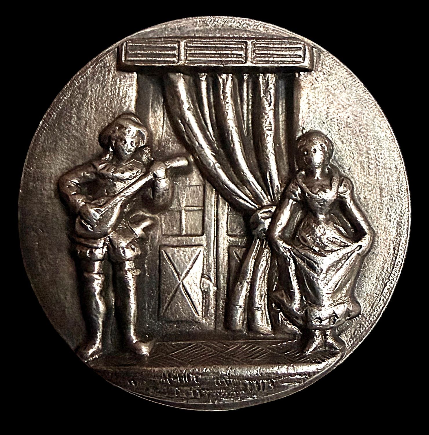 A large division one detailed button of Harlequin and Columbine.