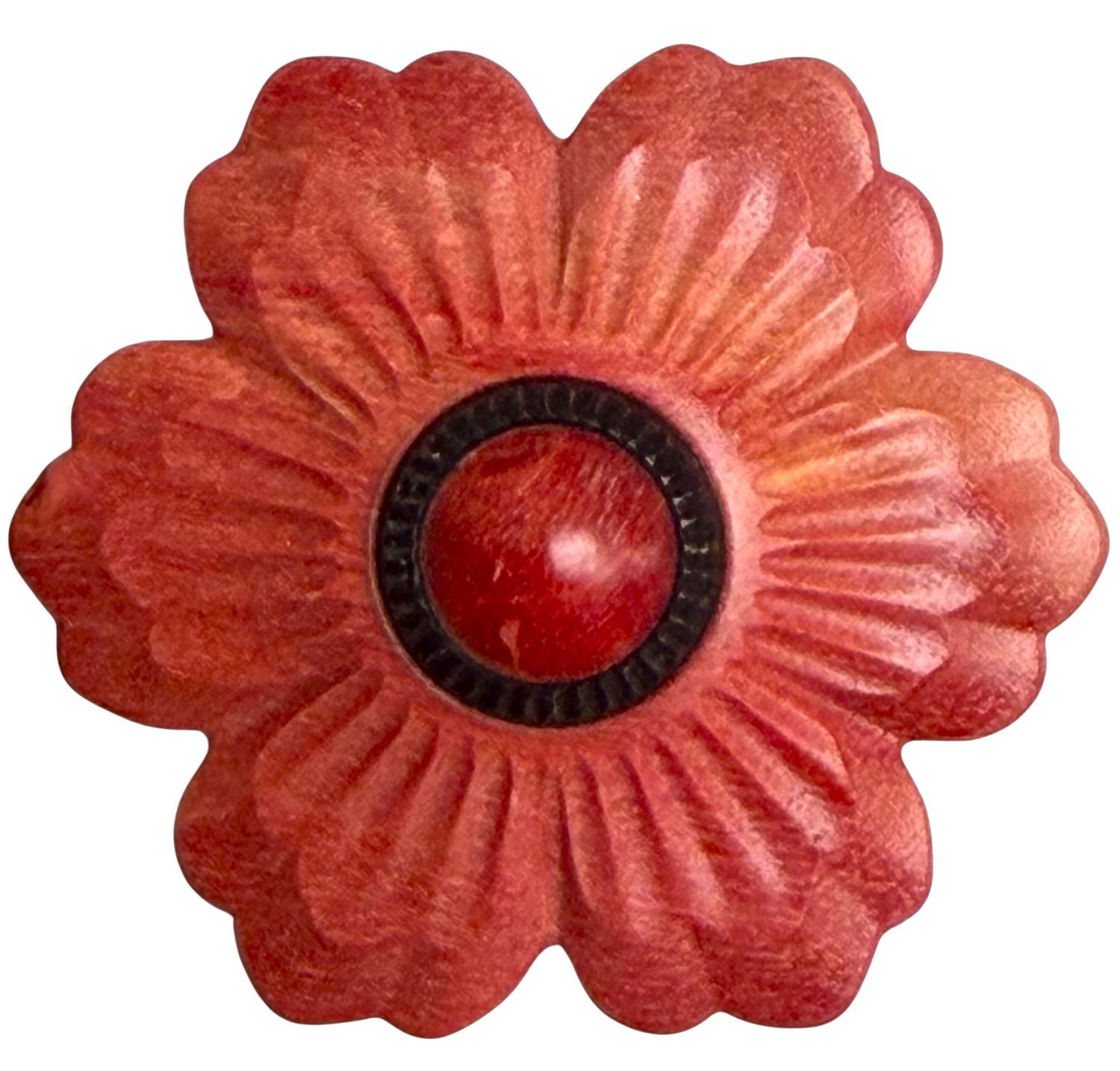 A large beautifully carved wood button by the artist Jon Sauer