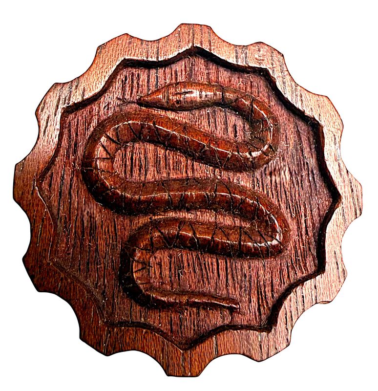 A lafrge division three wood snake button