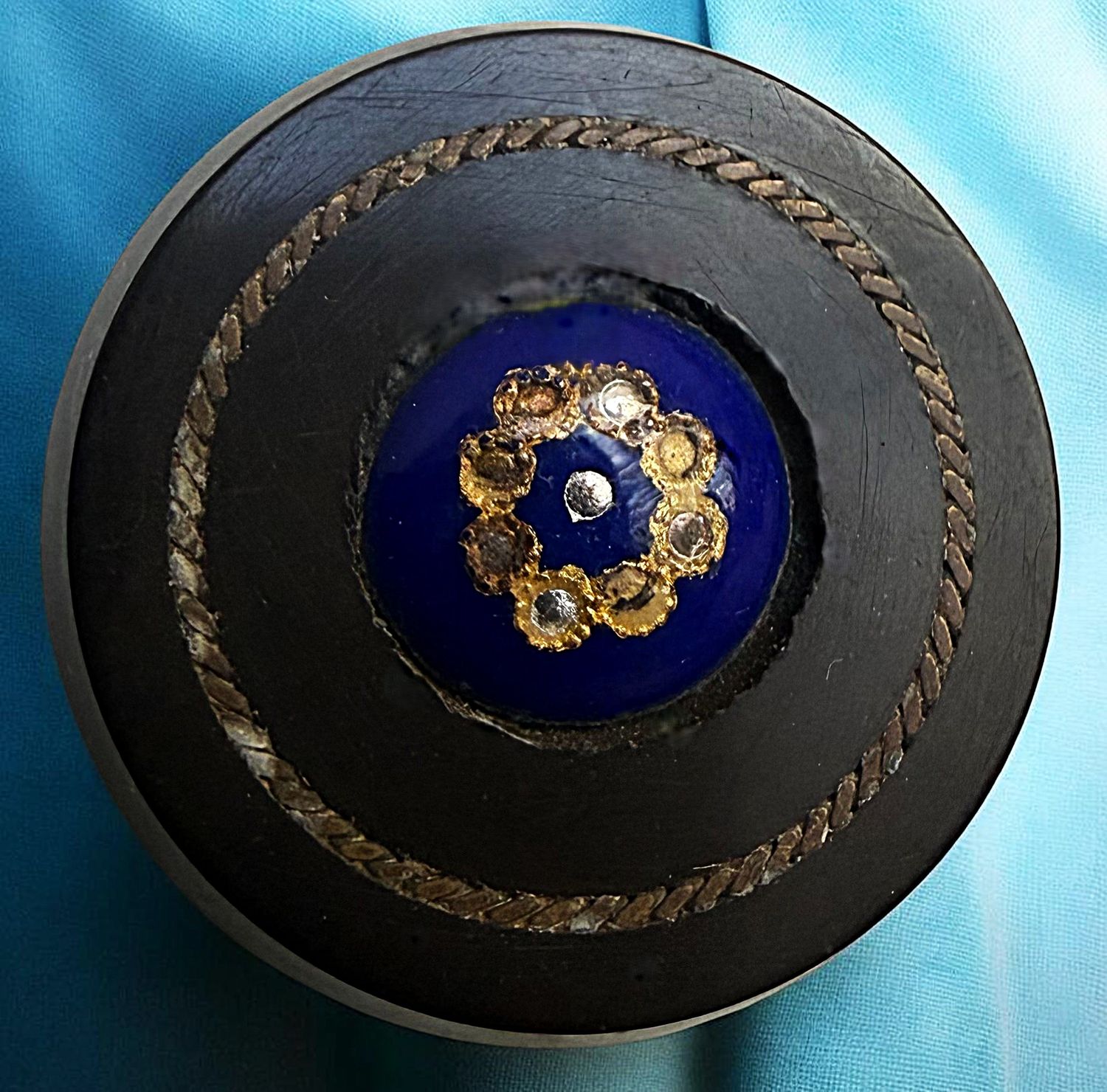 A scarce horn button with two other materials.