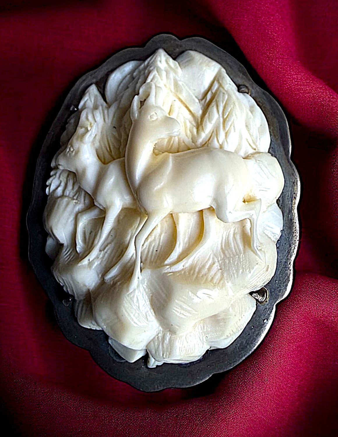 An incredible division one SCALLOPED carved animal in silver button