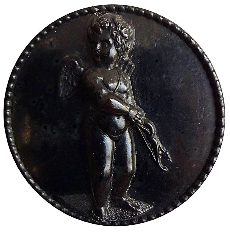 A dovision one black molded horn pictorial button