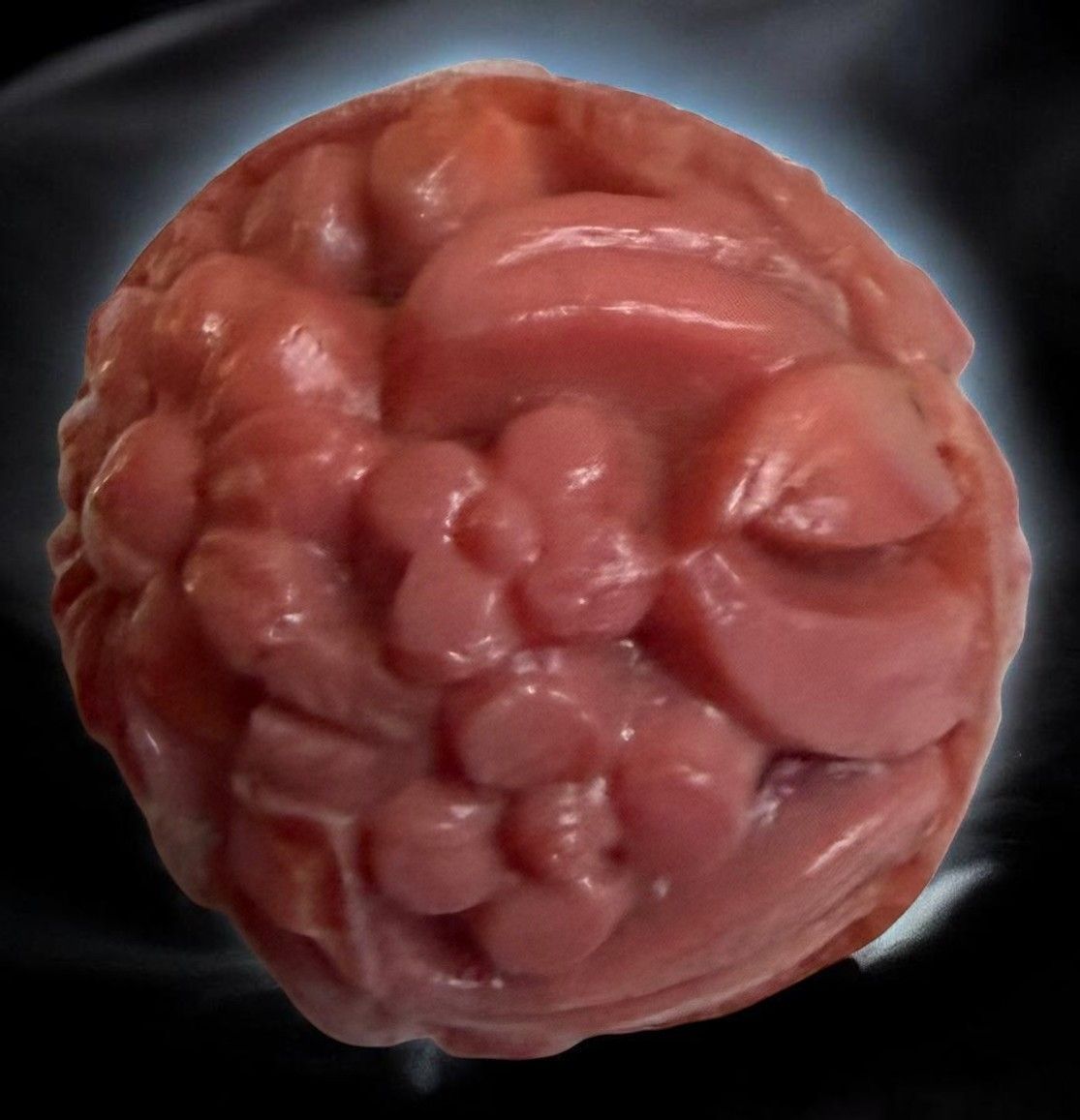 A scarce carved division one Coral BALL shaped button