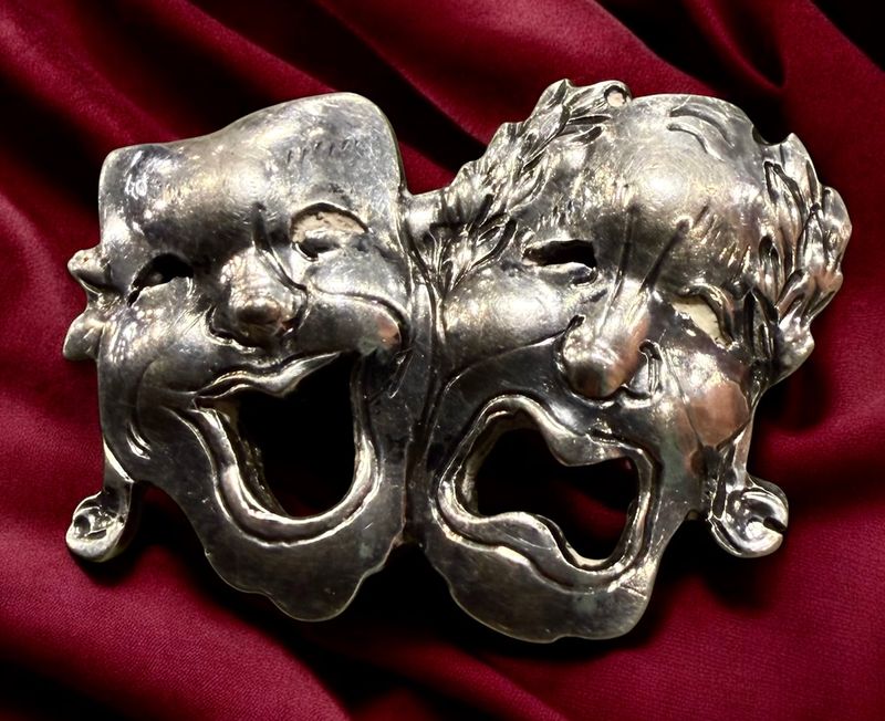 A high quality silver Theatre Masks button!