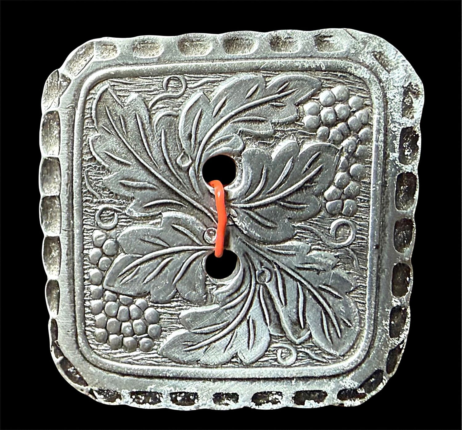 A large 20th century sew thru aluminium button!