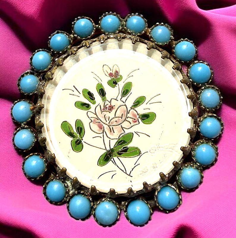 A beautiful painted on paper under glass button