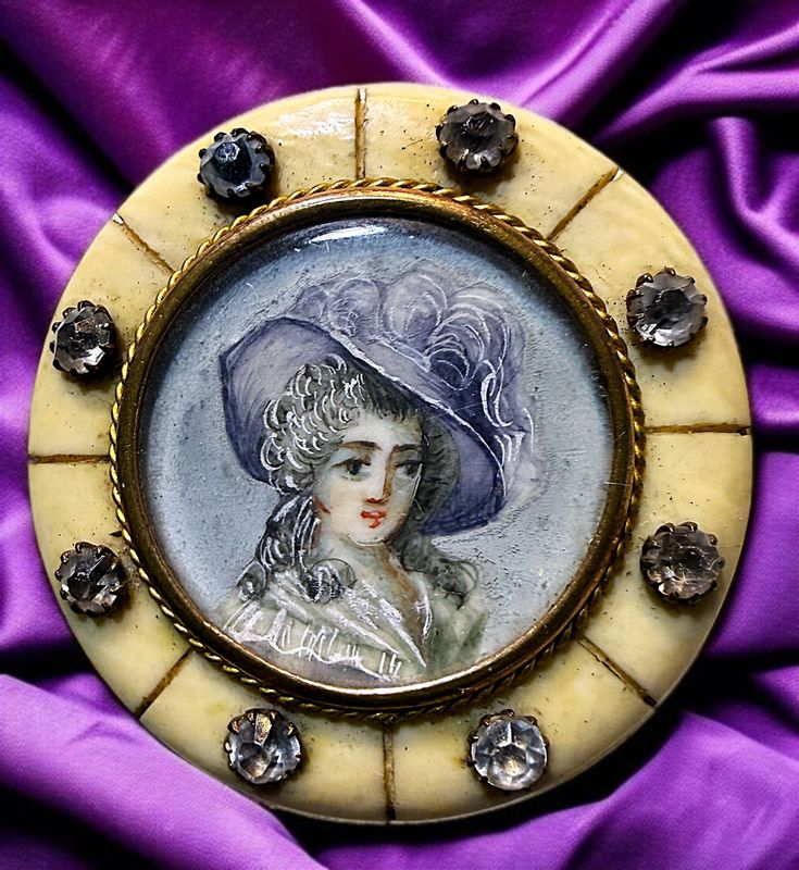 An unusual large 19th century hand painted button