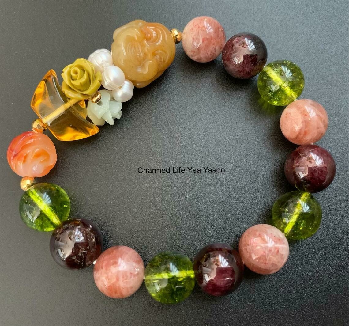 Yellow Jade, Laughing Buddha, Ingot, Carnelian Peony, 12mm Peridot Quartz, Garnet, Sunstone Quartz Yellow Jade, Laughing Buddha, Ingot, Carnelian Peony, 12mm Peridot Quartz, Garnet, Sunstone Quartz