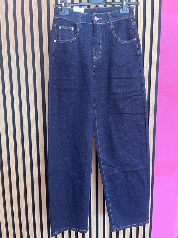 Jeans con tasca in pelle
