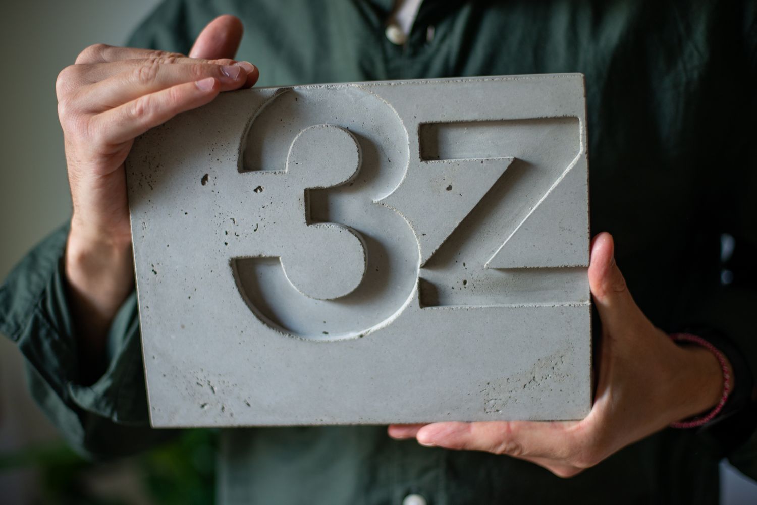 brutalist house number in concrete. custom door sign