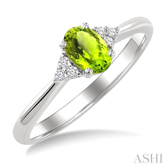 10KT White Gold Oval Peridot Six Round Diamond Accent Ring 10KT White Gold Oval Peridot Six Round Diamond Accent Ring