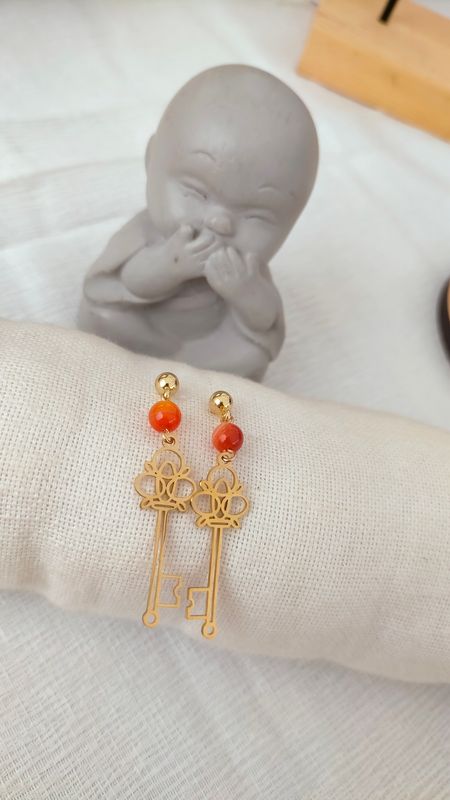 Boucle d'oreille Clef