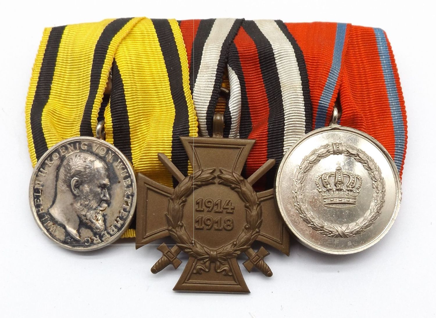 Württemberg: 3-er Ordenschnalle, silberne Militärverdienstmedaille, FEK, Dienstauszeichnung für 9 Jahre.