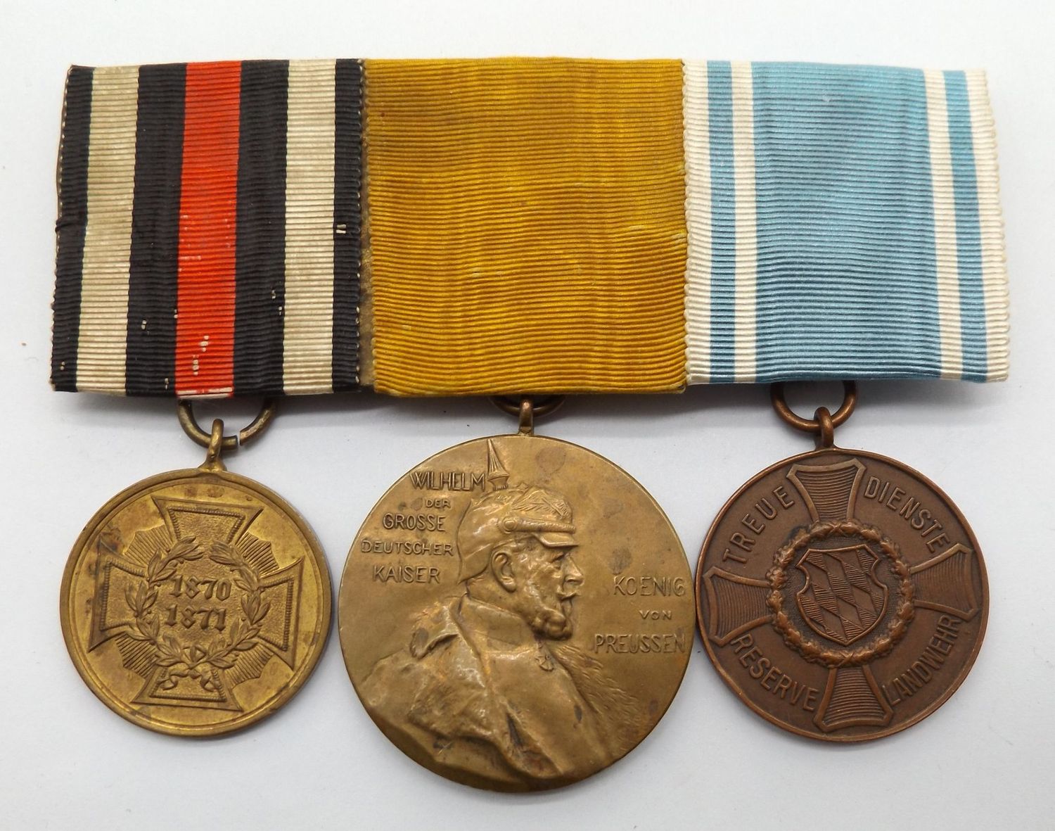 Bayern: 3-er Ordensschnalle Veteran 1870/71, Kriegsdenkmünze 1870/71 für Kämpfer, Centenarmedaille, Landwehr Dienstauszeichnung 2. Klasse.