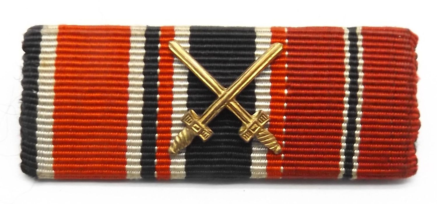 Wehrmacht: 3-er Feldspange, EK2, KVK 2. Klasse mit X, Ostmedaille.