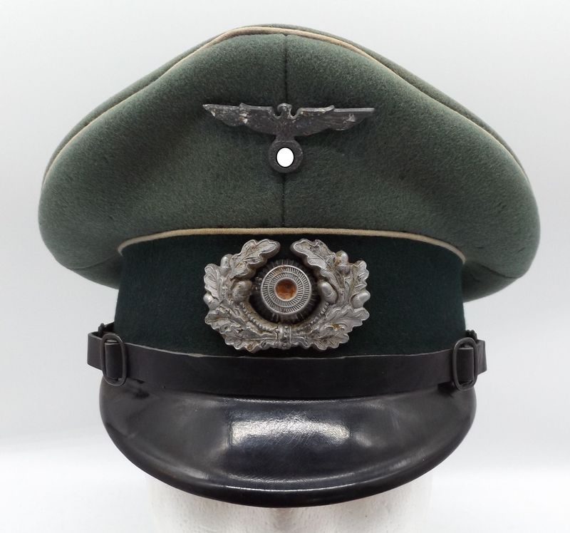 Wehrmacht: Schirmmütze für Unteroffiziere und Mannschaften der Infanterie, Cellon-Trapez mit Hersteller Peküro, Trägernamen.