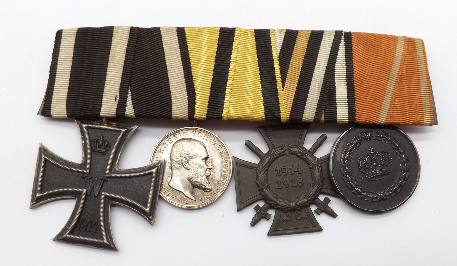 Württemberg: 4-er Ordenschnalle, EK2, silberne Militärverdienstmedaille, FEK, Dienstauszeichnung für 9 Jahre.