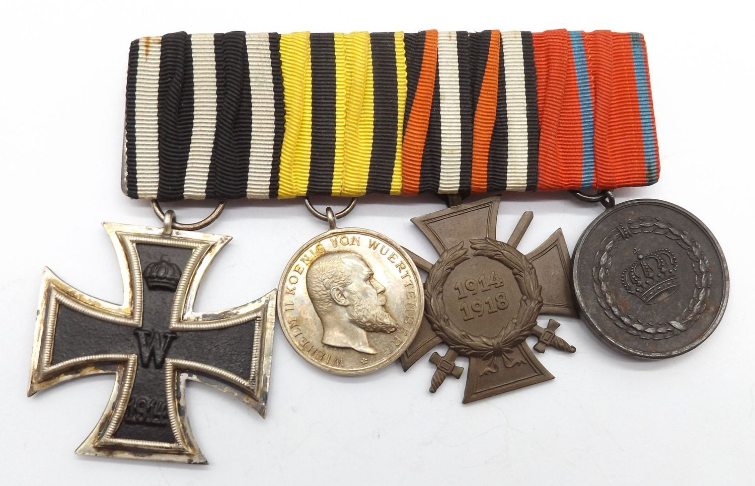 Württemberg: 4-er Ordenschnalle, EK2, silberne Militärverdienstmedaille, FEK, Dienstauszeichnung für 9 Jahre.