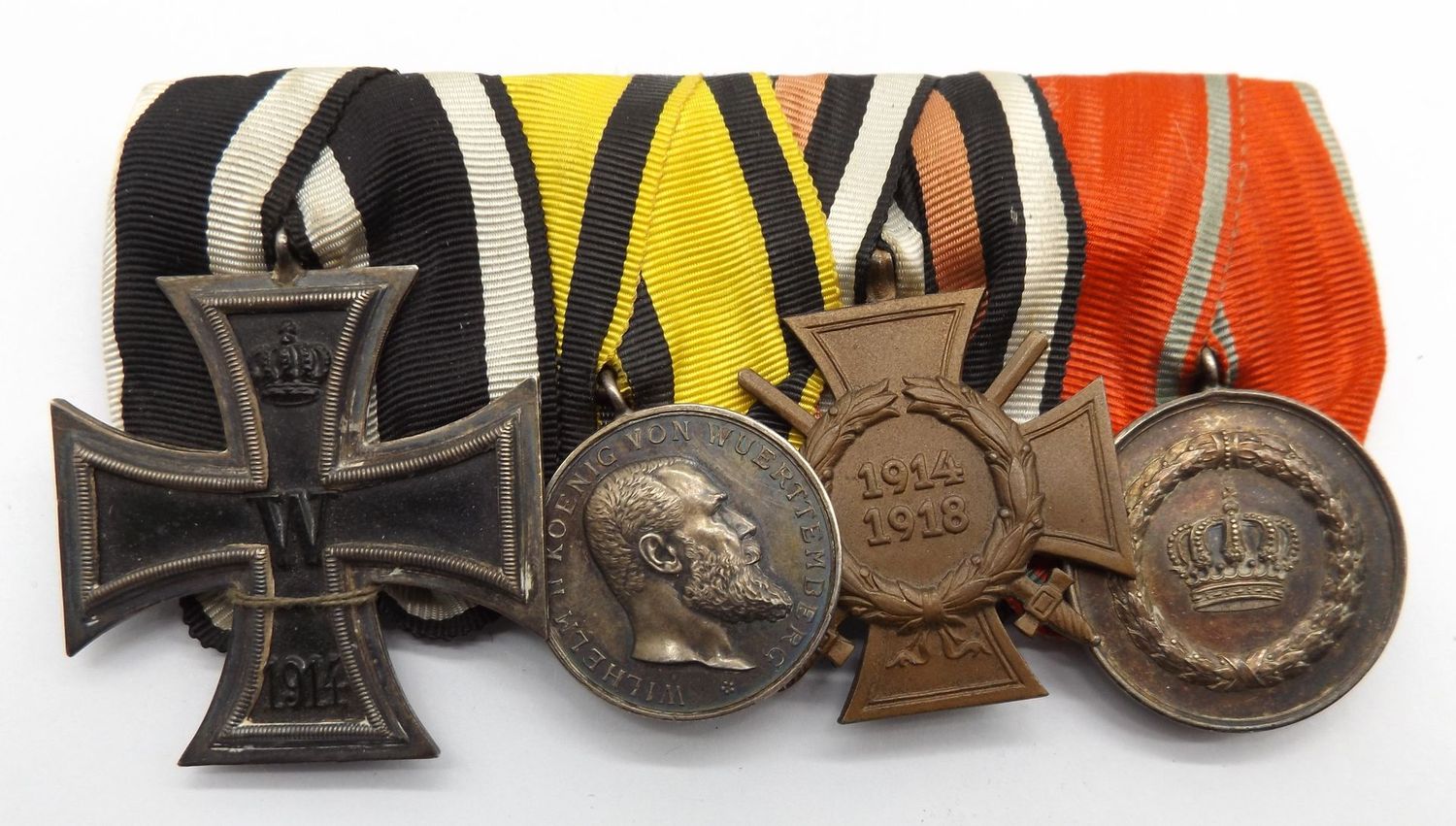 Württemberg: 4-er Ordensschnalle, EK2, silberne Militärverdienstmedaille, FEK, Dienstauszeichnung für 9 Jahre.