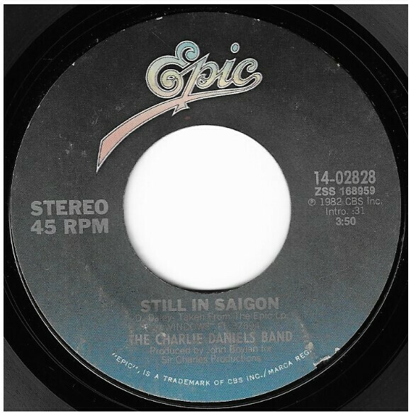 Daniels, Charlie (Band) / Still In Saigon | Epic 14-02828 | Single, 7&quot; Vinyl | March 1982