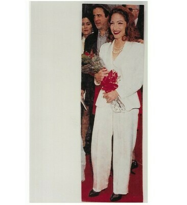 Estefan, Gloria / Dressed in White, Holding Red Flowers | Photo Print