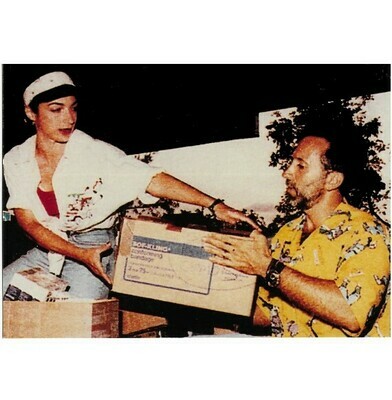 Estefan, Gloria / Unloading Boxes for Hurricane Andrew Relief | Photo Print | with Emilio Estefan | 1992