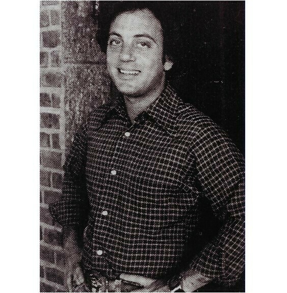 Joel, Billy / Standing Near Doorway, Checked Shirt | Photo Print | 1983
