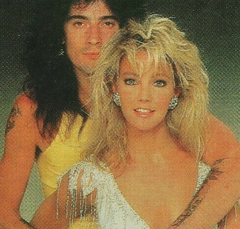 Locklear, Heather / With Tommy Lee, Heather in Silver Low-Cut Dress | Photo Print | 1986