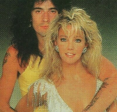 Locklear, Heather / With Tommy Lee, Heather in Silver Low-Cut Dress | Photo Print | 1986