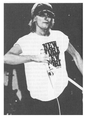 Stewart, Rod / On Stage Wearing New York New York Shirt and Visor | Magazine Photo | 1970s