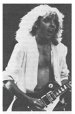 Frampton, Peter / On Stage-Mouth Open-Shirt Open-Playing Guitar | Magazine Photo | 1970s