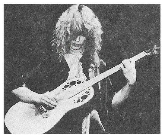 Heart / Nancy Wilson-On Stage-Looking Down-Playing Guitar--Large Version / 1970s