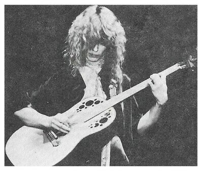 Heart / Nancy Wilson-On Stage-Looking Down-Playing Guitar--Large Version / 1970s
