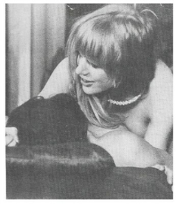 Faithfull, Marianne / On Couch with Friend-Wearing Necklace | Magazine Photo