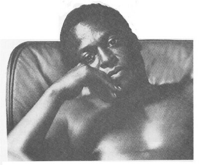 Davis, Miles / Sitting in Chair-Shirtless / 1960s