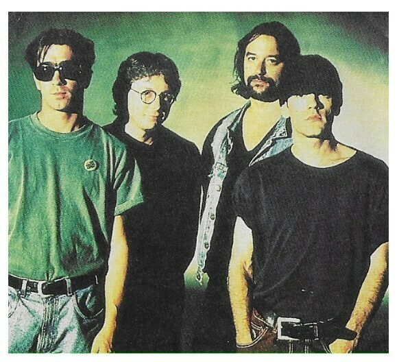 R.E.M. / Group Photo-Michael On Right-Green Background | Magazine Photo | 1992