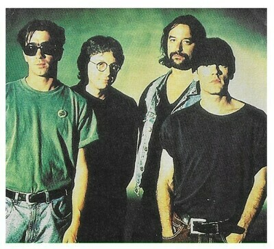 R.E.M. / Group Photo-Michael On Right-Green Background | Magazine Photo | 1992