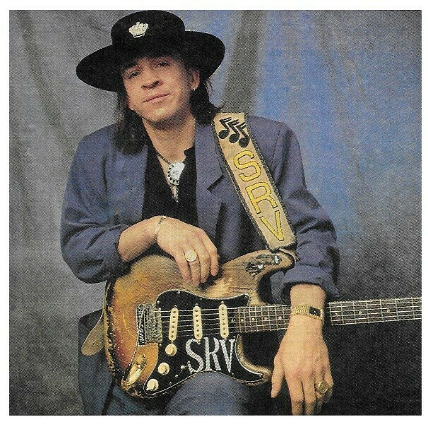 Vaughan, Stevie Ray / Dark Purple Outfit-Blue Background | Magazine Photo | 1990