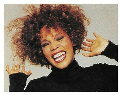 Houston, Whitney / In Black Turtleneck - White Background | Magazine Photo | 1990