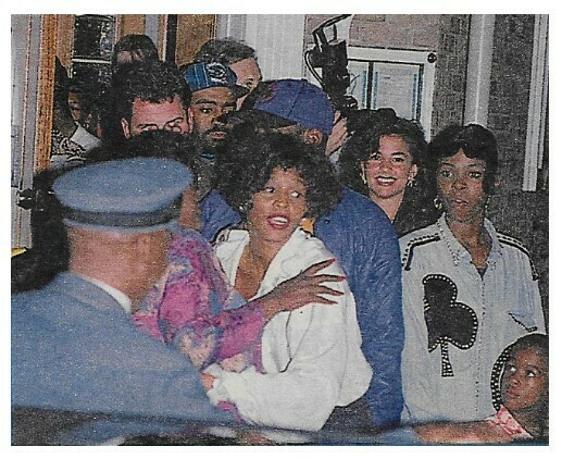 Houston, Whitney / Leaving Building with Group of People | Magazine Photo | 1992