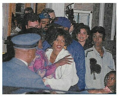 Houston, Whitney / Leaving Building with Group of People | Magazine Photo | 1992