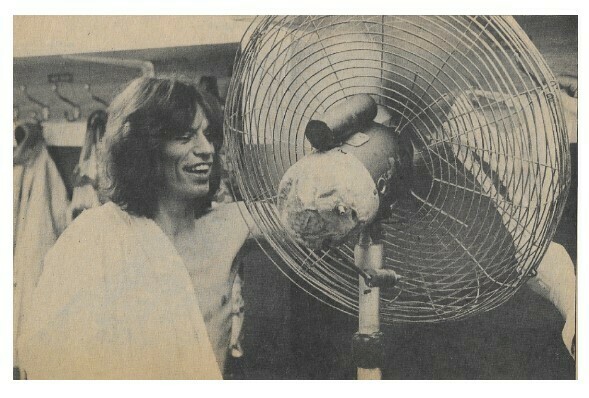 Jagger, Mick / Holding Women&#39;s Undergarment in Front of Electric Fan | Magazine Photo | September 1973