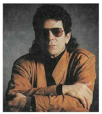 Reed, Lou / In Brown Jacket-Sunglasses-Grey Background | Magazine Photo | 1988