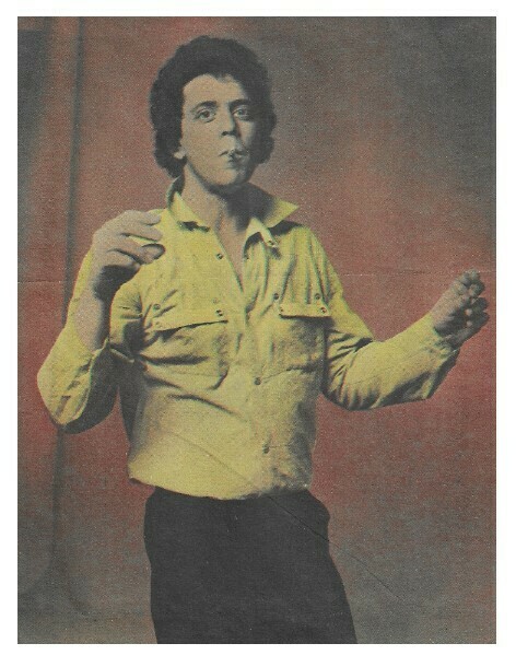 Reed, Lou / Standing-Arms Up-Cigarette-Yellow Shirt | Magazine Photo | 1979