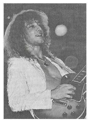 Chicago / Donnie Dacus On Stage-Smiling-Guitar | Magazine Photo
