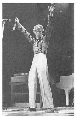 Bowie, David / On Stage-Baggy Pants-Arms Reaching Up | Magazine Photo