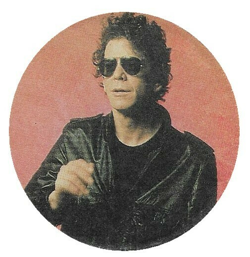 Reed, Lou / Black Jacket-Sunglasses-Light Red Background | Magazine Photo | 1986