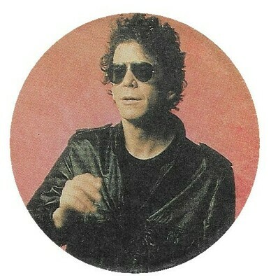 Reed, Lou / Black Jacket-Sunglasses-Light Red Background | Magazine Photo | 1986