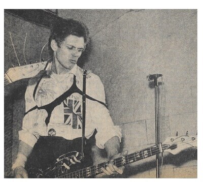 Clash, The / Paul Simonon On Stage, Mauling His Bass Guitar | March 1977